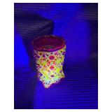 Red glass votive with uranium glass