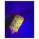 Red glass votive with uranium glass
