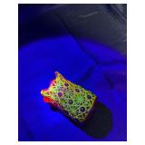 Red glass votive with uranium glass