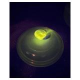 Brown Bakeware glass that glows green