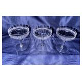 Needle etched crystal champagne coupes that glow