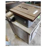 Dunlap table saw on wooden stand