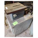 Dunlap table saw on wooden stand