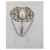 Vintage Gold-Tone Filigree Brooch with Oval Cabochon and Chain Tassels