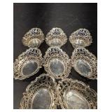 Group of small silver Baskets and olive grabber