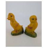 Pair of Yellow Duck Figurines on Leaf-Textured Green Bases