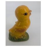 Pair of Yellow Duck Figurines on Leaf-Textured Green Bases
