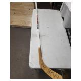 Wisconsin Badgers Signed Hockey Stick - Signed by Bill Buters and 1980's Miracle Olympian and Women's Head Coach Mark Johnson