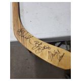 Wisconsin Badgers Signed Hockey Stick - Signed by Bill Buters and 1980's Miracle Olympian and Women's Head Coach Mark Johnson