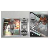 Lot of 2 Bijan Robinbson Rookie Cards including 2023 Panini Chronicles Black & Panini Chronicles Contenders Optic Draft Picks (NM-MT)
