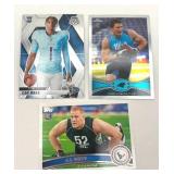 Lot of 3 Football Cards including 2012 Topps Chrome Luke Kuechly Rookie Card, 2011 Topps J.J. Watt Rookie Card, and 2025 Panini Mosaic Cam Ward Rookie Card (NM-MT)