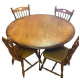 K - Vintage Round Oak Dining Table with Four Spindle-Back Chairs