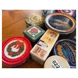 Large assortment of tins