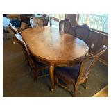 Dining room table with padded chairs