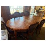 Dining room table with padded chairs
