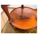 Round wooden shelving with decorative posts