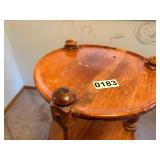 Round wooden shelving with decorative posts