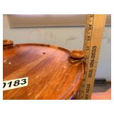 Round wooden shelving with decorative posts