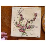 Rustic ceramic tile trivets of wildlife and cabin scenes