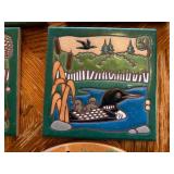 Rustic ceramic tile trivets of wildlife and cabin scenes