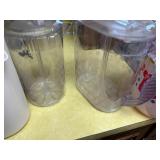Assortment of pitchers with lids