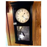 Wall clock with eagle depiction