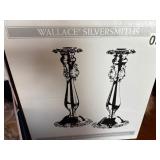 New in box silver platted gravy bowl and candlesticks