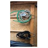 lots of garden hoses and Wall hangers