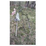 lot of outdoor decorations, including an umbrella, howling, dog statues, and wind catchers