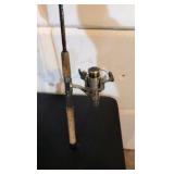 two fishing poles one still has a tag
