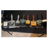 A lot of paint brushes eight in total