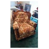 two wooden chairs with design
