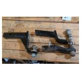 Lot of trailer hitches and balls