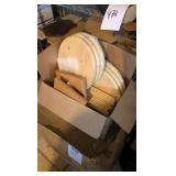 two boxes of of wooden rounds and other wooden items
