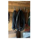 lots of garden hoses and Wall hangers