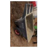 three wheelbarrows and one rolling cart