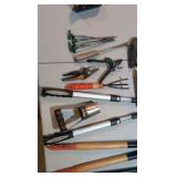 assortment of garden tools and snips