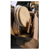 two boxes of of wooden rounds and other wooden items