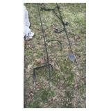 lot of outdoor decorations, including an umbrella, howling, dog statues, and wind catchers