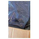 box of button-up cotton shirts