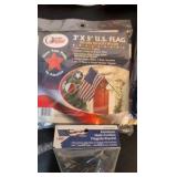 Three flags and flag holder. two flags are still in the bag