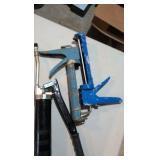 Grease gun ear protection, caulk gun and trailer hitch