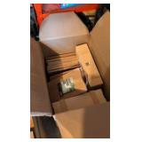 Large box of items bamboo cutting board, cork board boxes and more