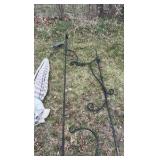 lot of outdoor decorations, including an umbrella, howling, dog statues, and wind catchers