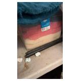 One container of various zip up hoodies and container of towels