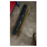 two pool sticks in cases