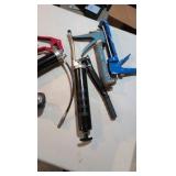 Grease gun ear protection, caulk gun and trailer hitch