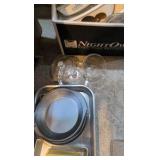box of household dishware and pans