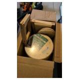 two boxes of of wooden rounds and other wooden items