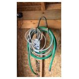 lots of garden hoses and Wall hangers